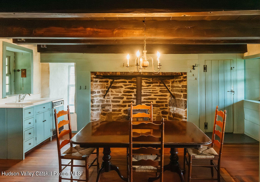652 Albany Post Road New Paltz, NY 12561 - Photo 10 of 36 a view of a dining room with furniture and wooden floor