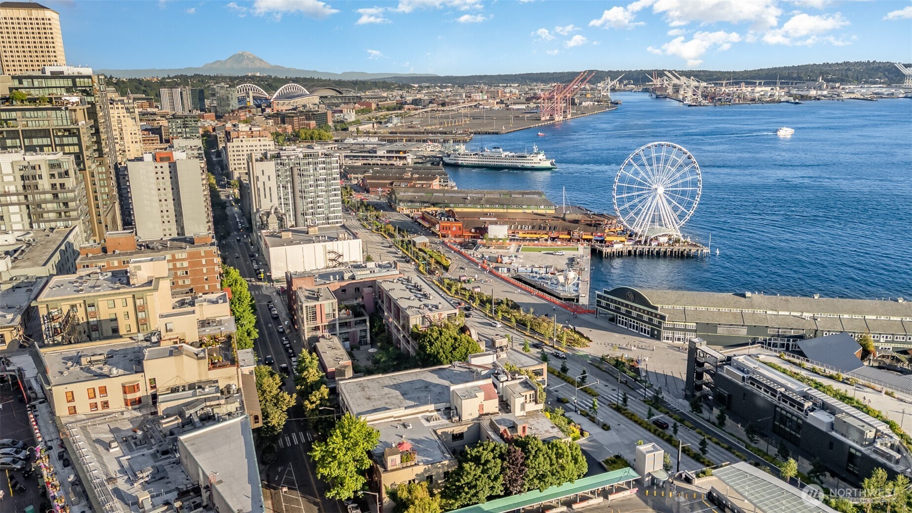 1507 Western Avenue, Unit R203 Seattle, WA 98101 - Photo 2 of 18 an aerial view of a house with a ocean view