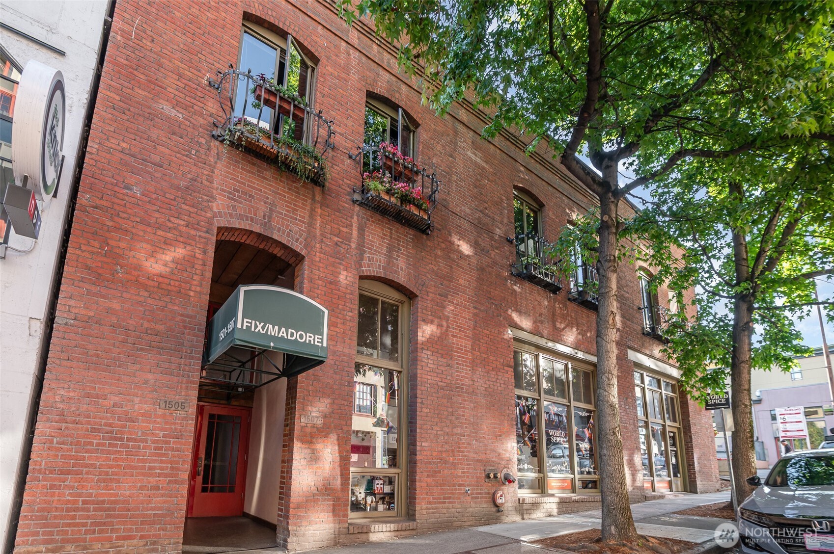 1507 Western Avenue, Unit R203 Seattle, WA 98101 - Photo 5 of 18 a front view of a building with a tree