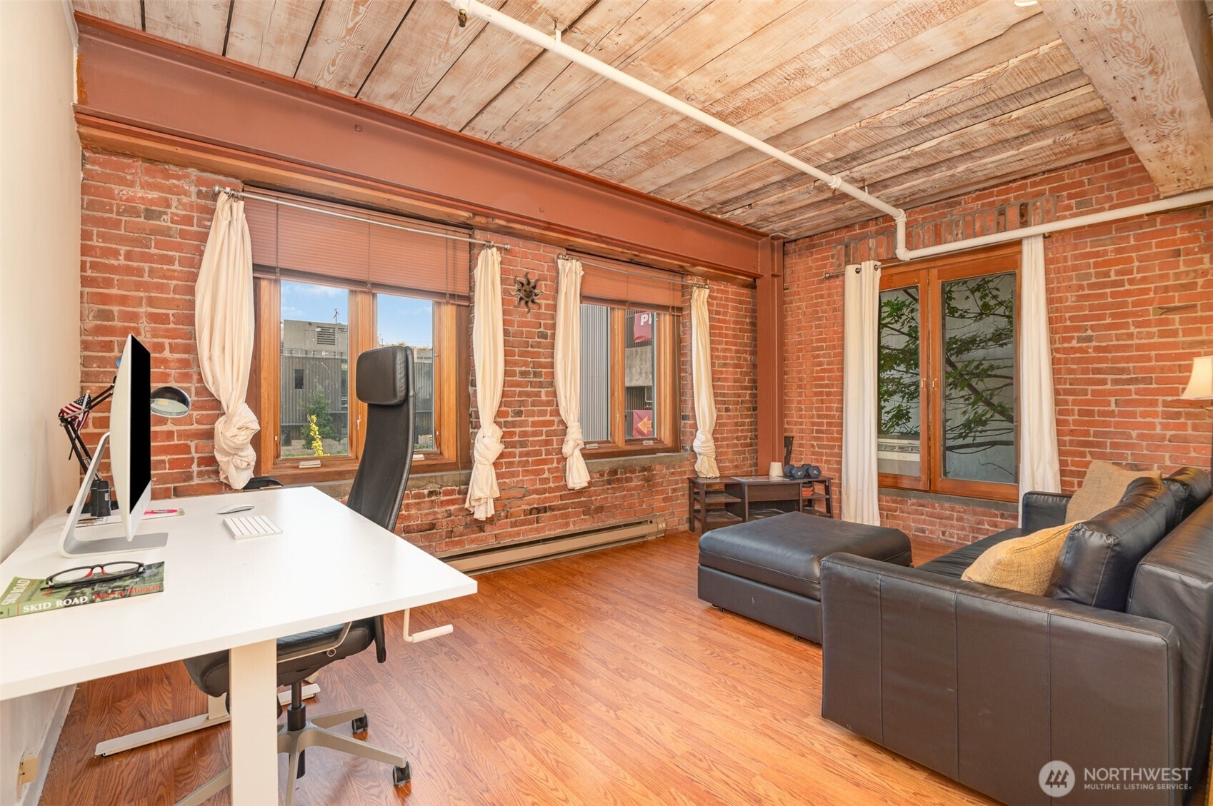 1507 Western Avenue, Unit R203 Seattle, WA 98101 - Photo 8 of 18 a living room with furniture and a large window