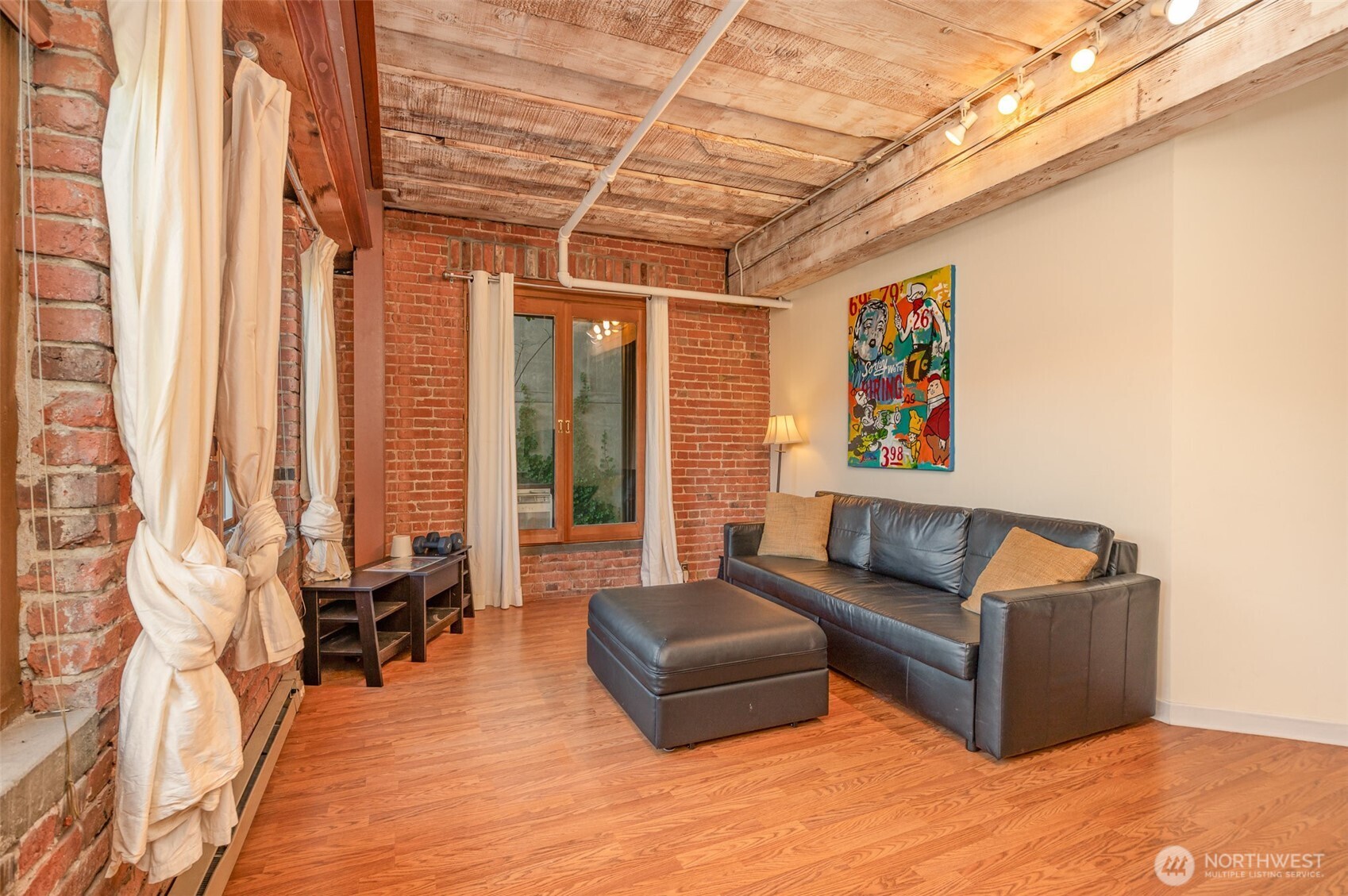 1507 Western Avenue, Unit R203 Seattle, WA 98101 - Photo 9 of 18 a living room with furniture and a large window