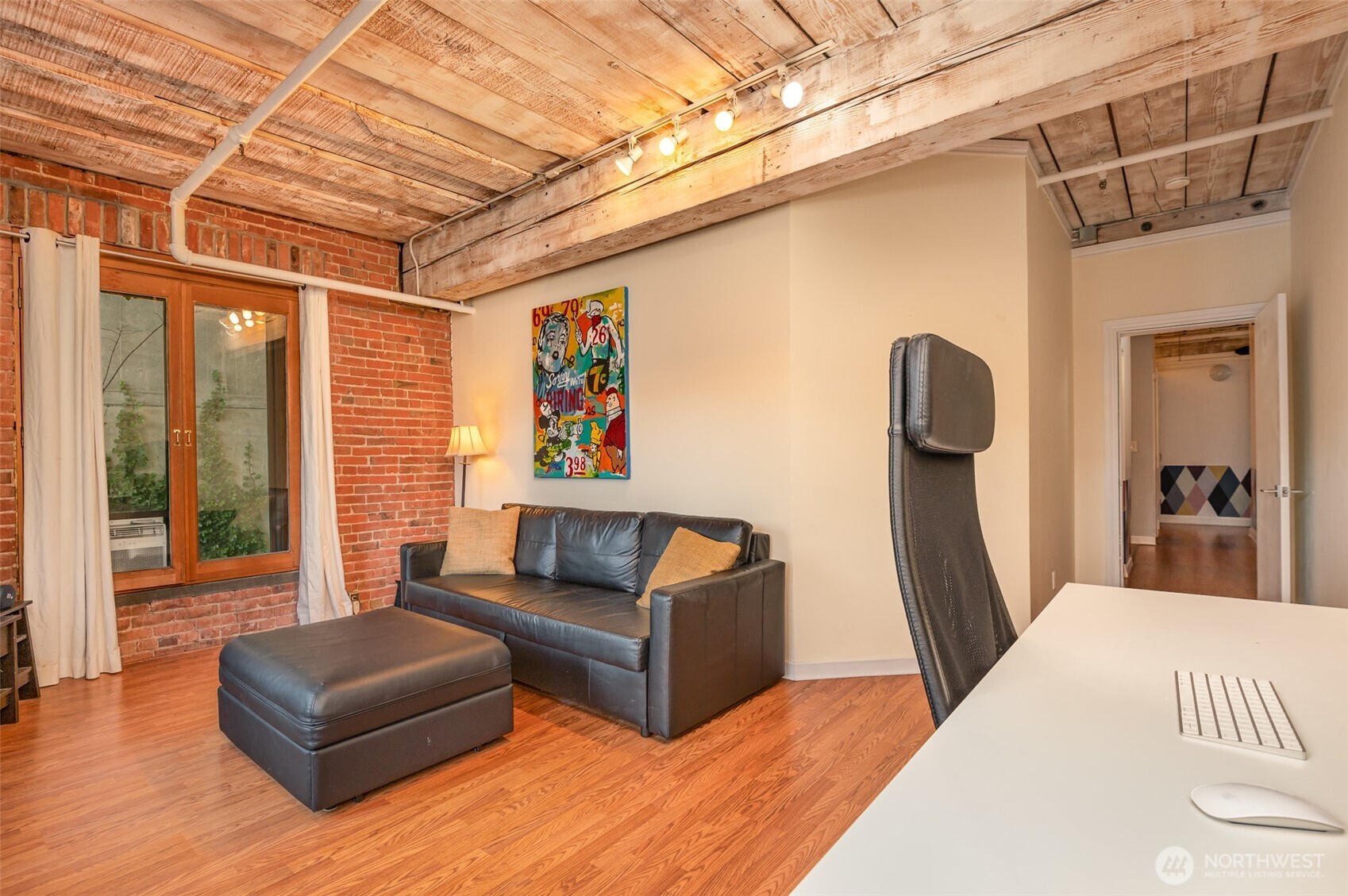 1507 Western Avenue, Unit R203 Seattle, WA 98101 - Photo 10 of 18 a living room with furniture and a window