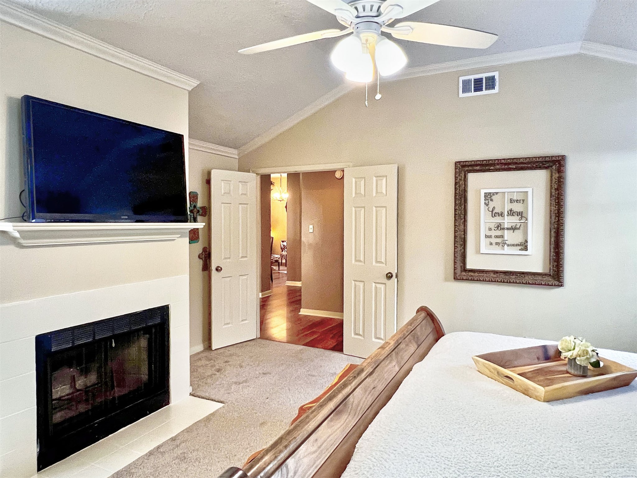 12510 Millvan Drive Houston, TX 77070 - Photo 15 of 46 a bedroom with a bed and a fireplace