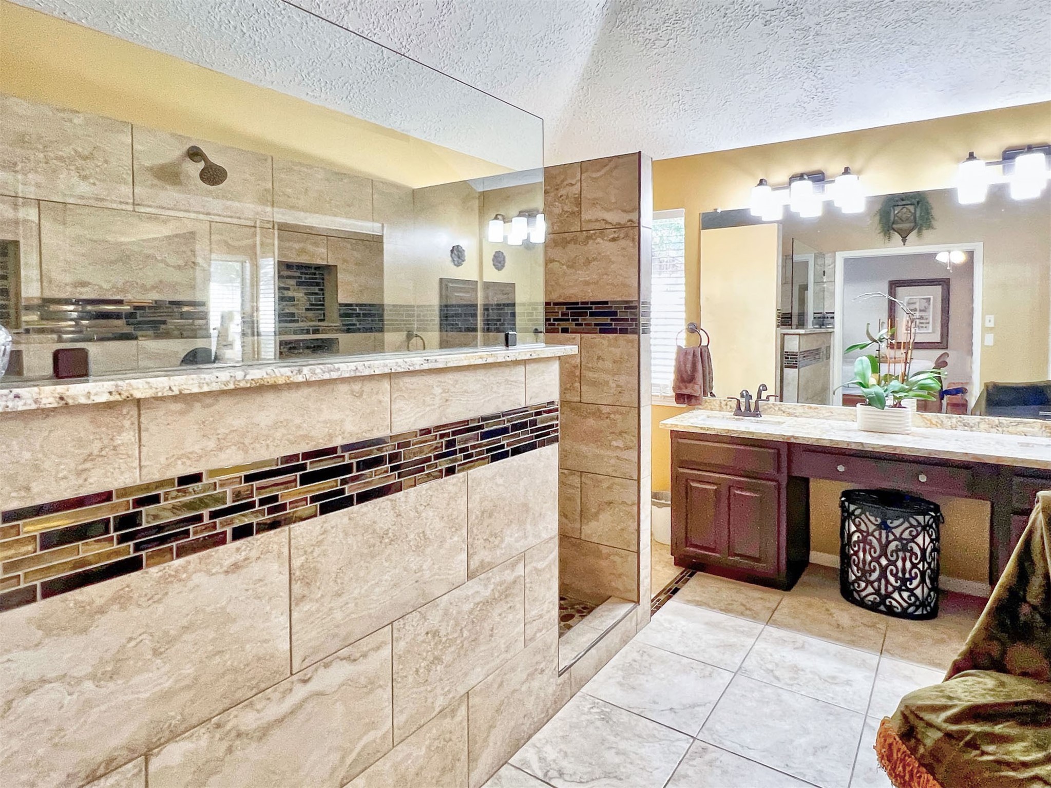 12510 Millvan Drive Houston, TX 77070 - Photo 17 of 46 a large kitchen with kitchen island granite countertop a large counter top and wooden floors