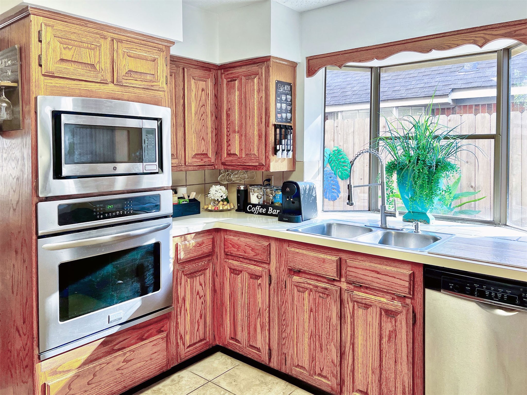 12510 Millvan Drive Houston, TX 77070 - Photo 25 of 46 a kitchen with stainless steel appliances granite countertop a stove a microwave and a sink