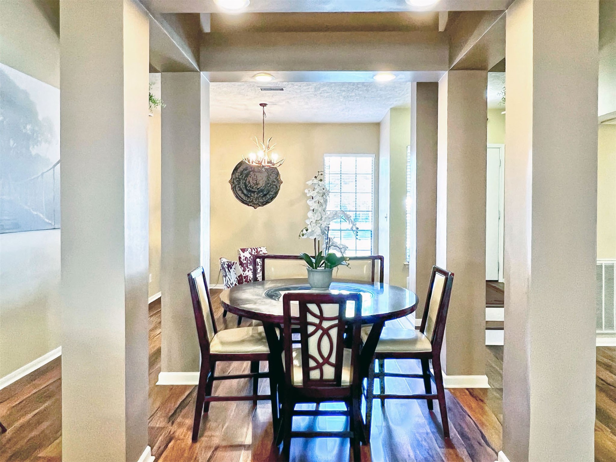 12510 Millvan Drive Houston, TX 77070 - Photo 9 of 46 a view of a dining room with furniture and wooden floor