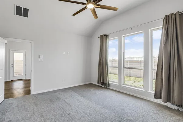 a view of an empty room with a window
