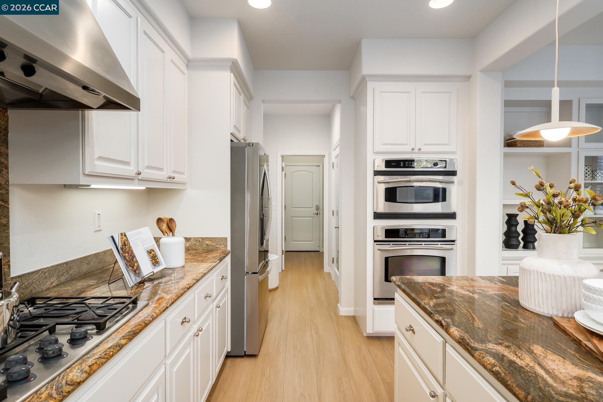 3138 Ashbrook Lane San Ramon, CA 94582 - Photo 12 of 27 a kitchen with stainless steel appliances granite countertop a stove a sink and a refrigerator