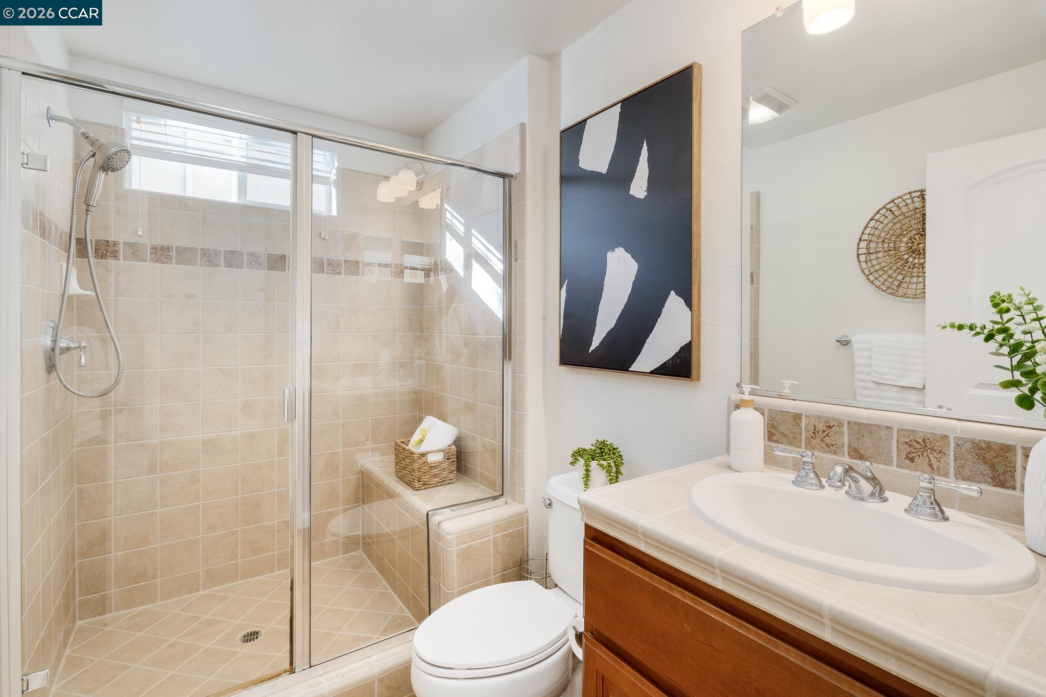 3138 Ashbrook Lane San Ramon, CA 94582 - Photo 14 of 27 a bathroom with a sink toilet and shower