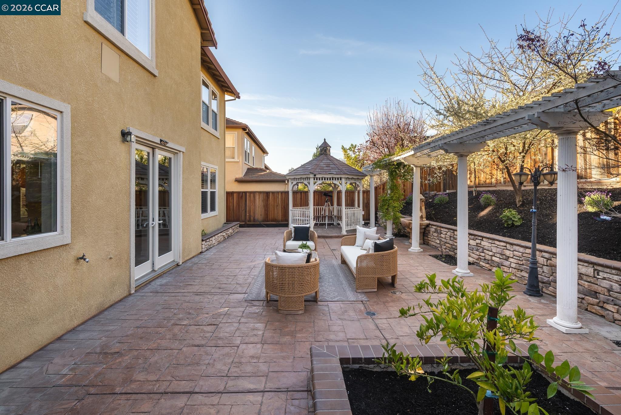 3138 Ashbrook Lane San Ramon, CA 94582 - Photo 24 of 27 a view of a patio with couches table and chairs and potted plants