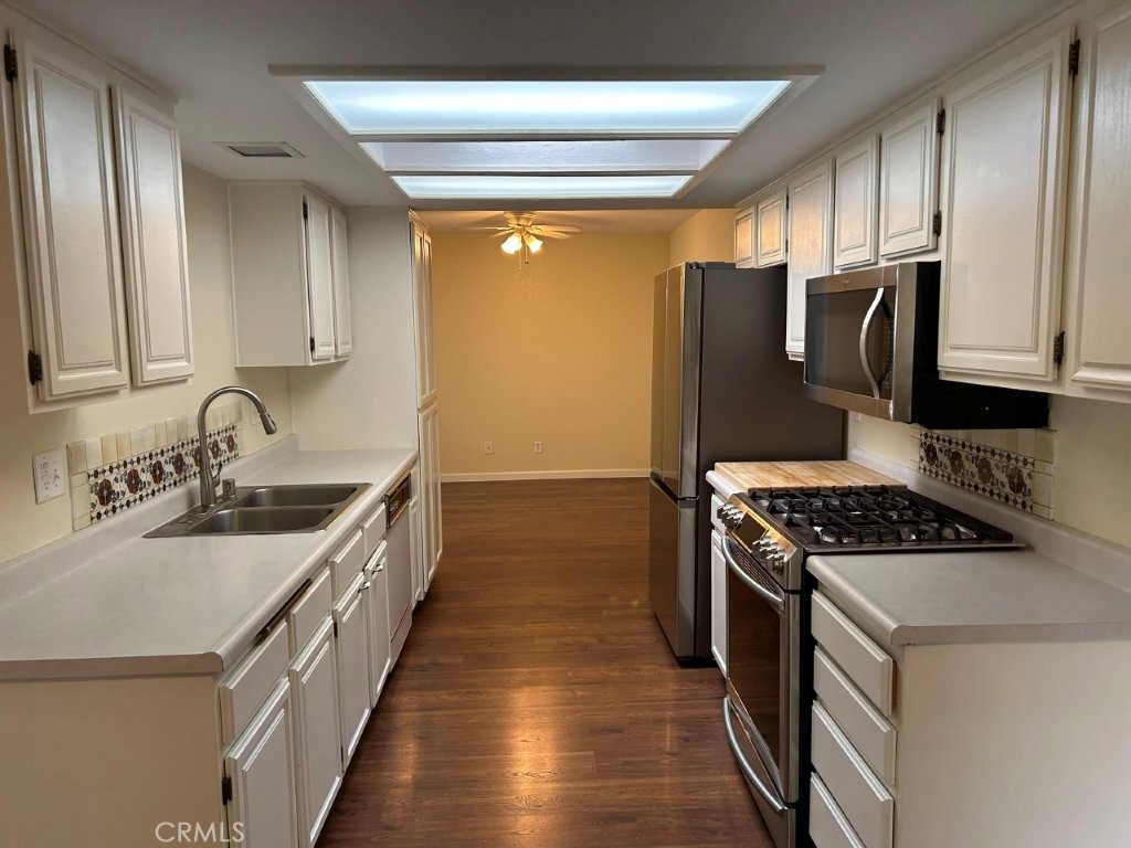 1743 Northview Place Paso Robles, CA 93446 - Photo 13 of 26 a kitchen with granite countertop a sink a stove and refrigerator
