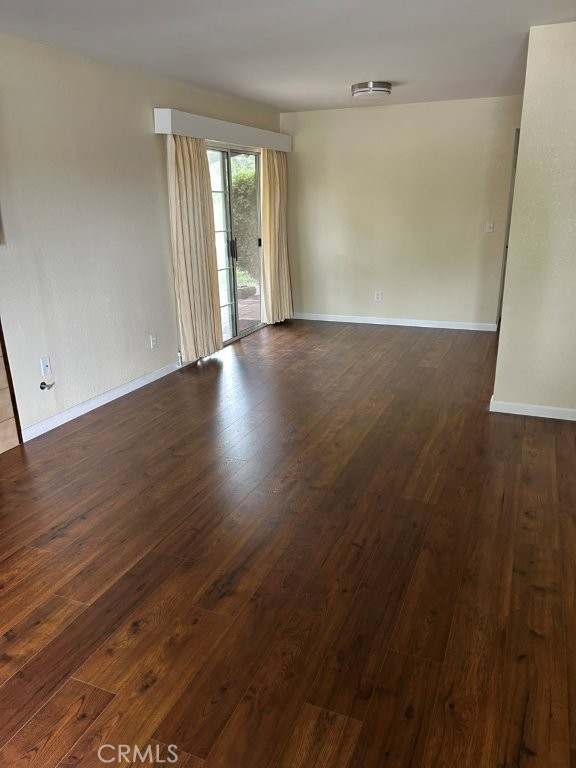 1743 Northview Place Paso Robles, CA 93446 - Photo 4 of 26 an empty room with wooden floor and windows