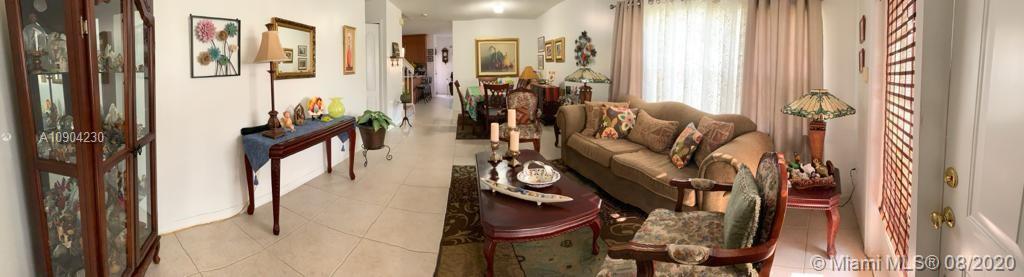 6857 Southwest 158th Pass Miami, FL 33193 - Photo 13 of 41 a view of walk in closet with clothes and shoes