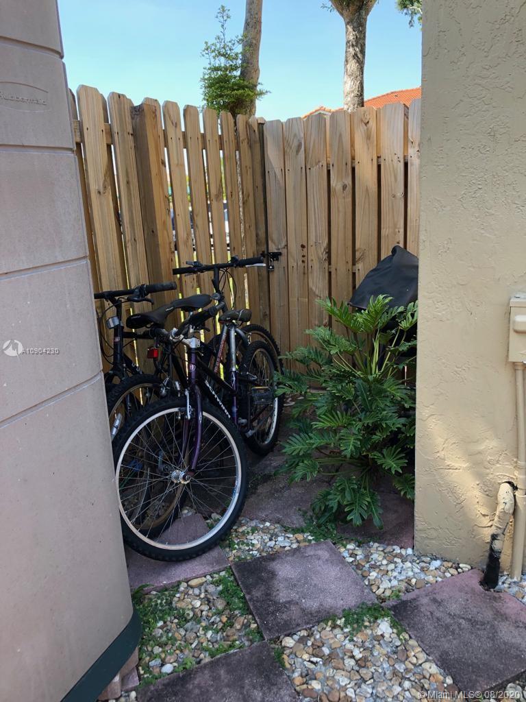 6857 Southwest 158th Pass Miami, FL 33193 - Photo 19 of 41 a view of a chairs and wooden fence