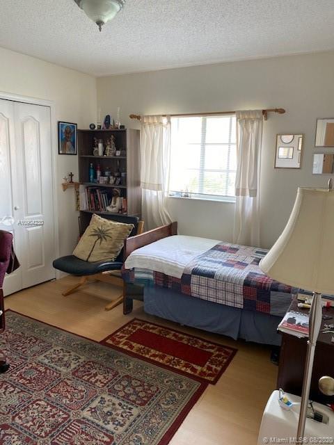 6857 Southwest 158th Pass Miami, FL 33193 - Photo 20 of 41 a bedroom with a bed and window