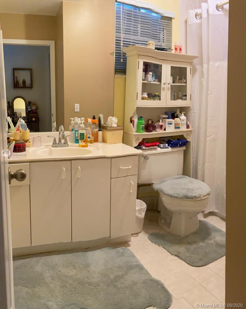 6857 Southwest 158th Pass Miami, FL 33193 - Photo 25 of 41 a bathroom with a sink toilet and shower