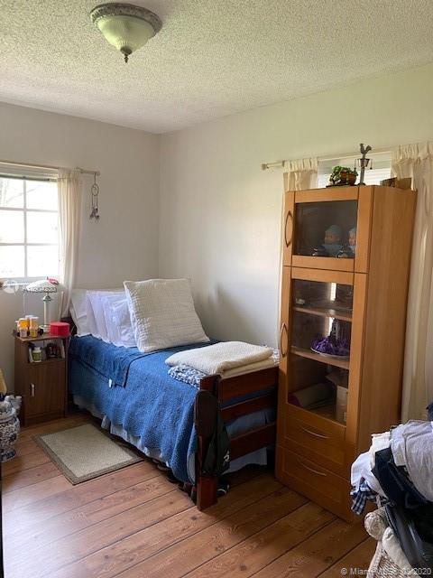 6857 Southwest 158th Pass Miami, FL 33193 - Photo 26 of 41 a living room with a bed and furniture