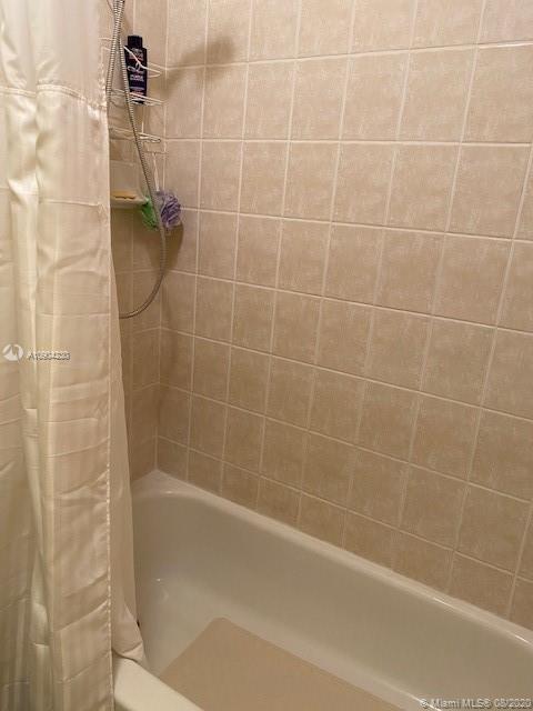 6857 Southwest 158th Pass Miami, FL 33193 - Photo 29 of 41 a bathroom with a shower and a bathtub