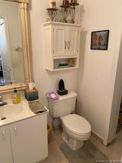 6857 Southwest 158th Pass Miami, FL 33193 - Photo 33 of 41 a bathroom with a toilet sink and mirror