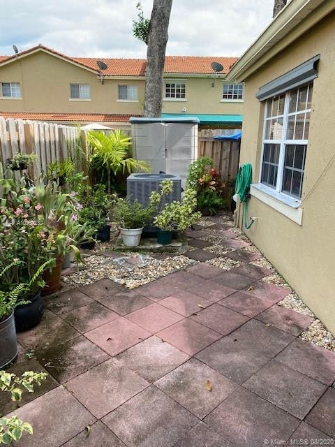 6857 Southwest 158th Pass Miami, FL 33193 - Photo 36 of 41 a front view of a house with garden