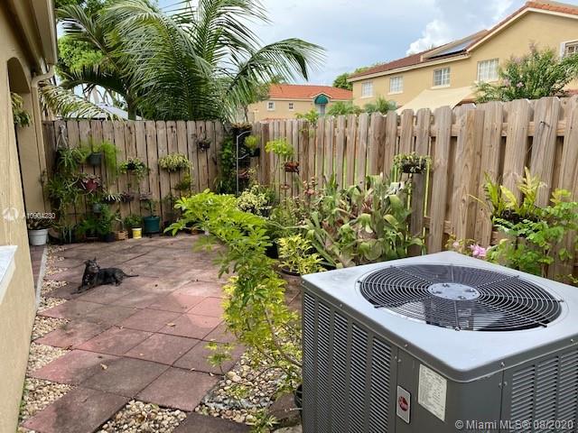 6857 Southwest 158th Pass Miami, FL 33193 - Photo 39 of 41 a house view with a garden space