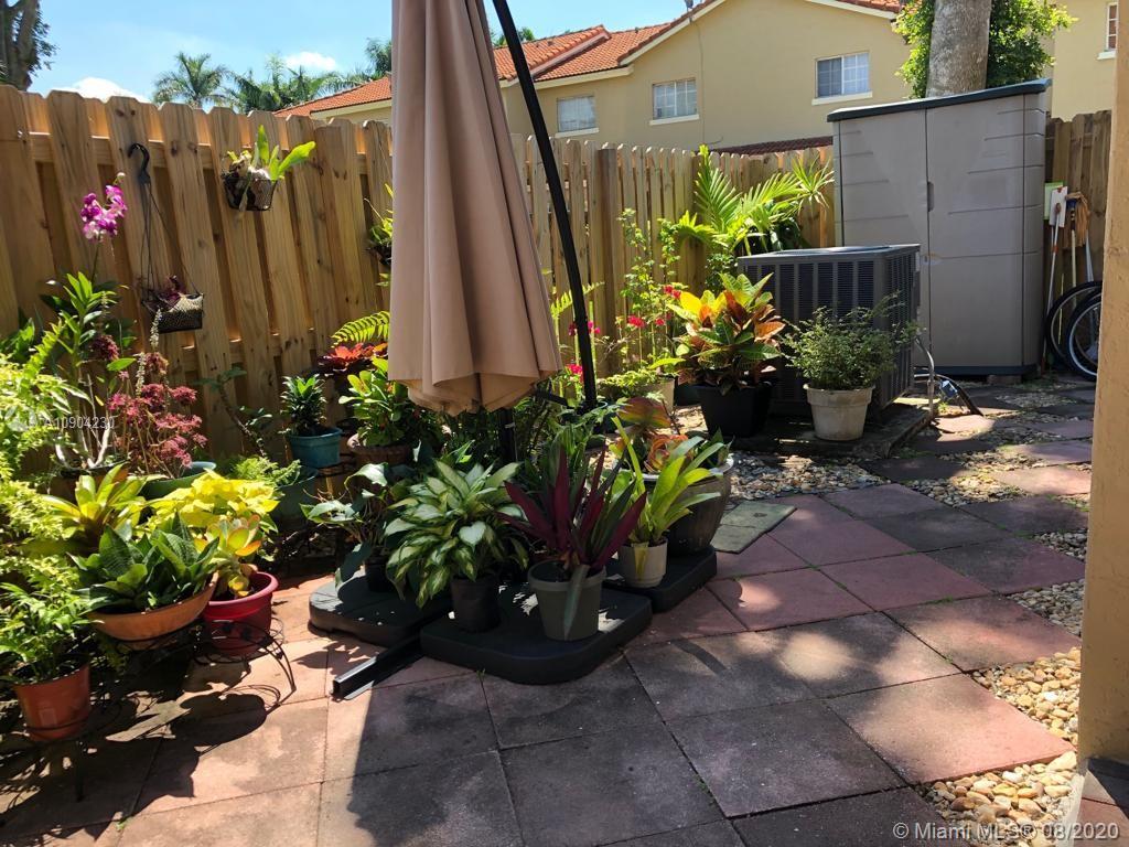 6857 Southwest 158th Pass Miami, FL 33193 - Photo 40 of 41 a view of a backyard with potted plants