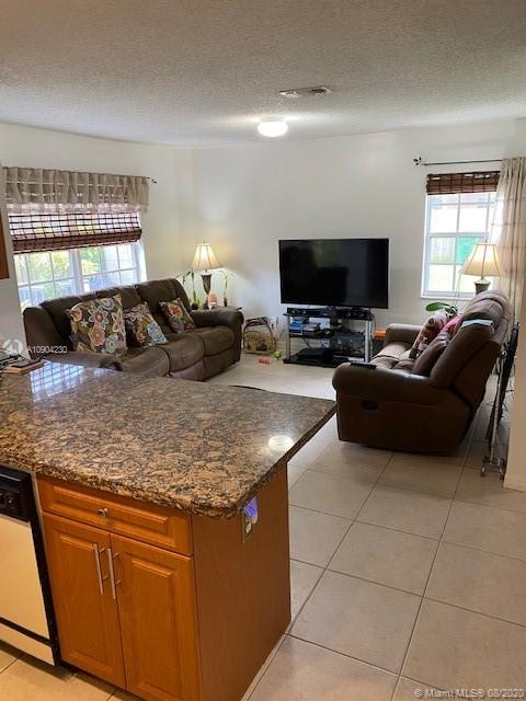 6857 Southwest 158th Pass Miami, FL 33193 - Photo 9 of 41 a living room with furniture and a flat screen tv