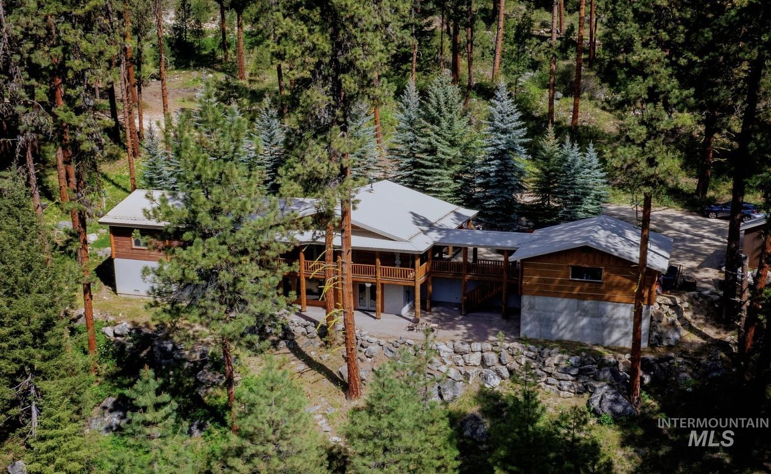 85 Pine Top Road Boise, ID 83716 - Photo 1 of 33 Spacious property featuring multiple structures and a substantial rock retaining wall