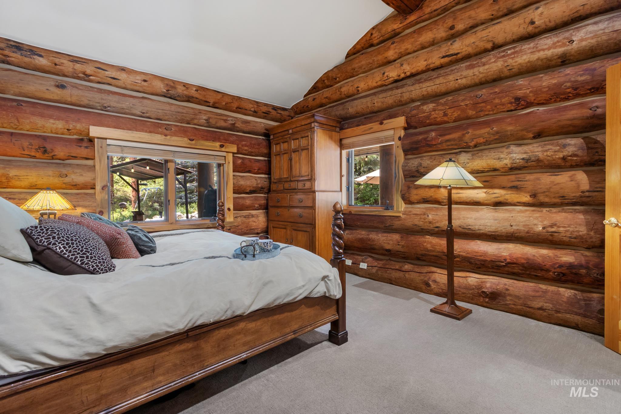 85 Pine Top Road Boise, ID 83716 - Photo 16 of 33 Log-style interior walls feature natural wood finishes
