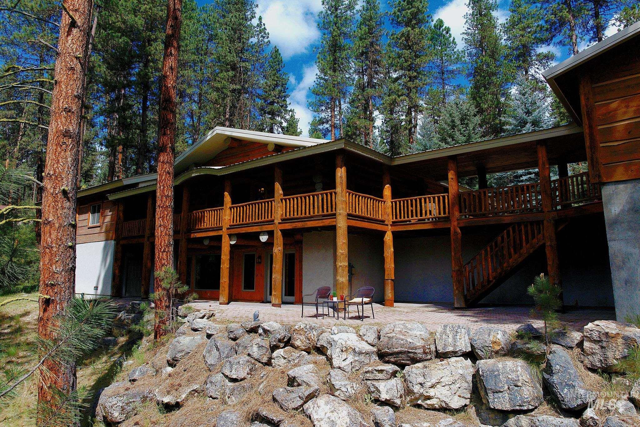85 Pine Top Road Boise, ID 83716 - Photo 2 of 33 Multi-level timber frame exterior featuring a covered balcony, exposed wood railings, and a lower-level patio