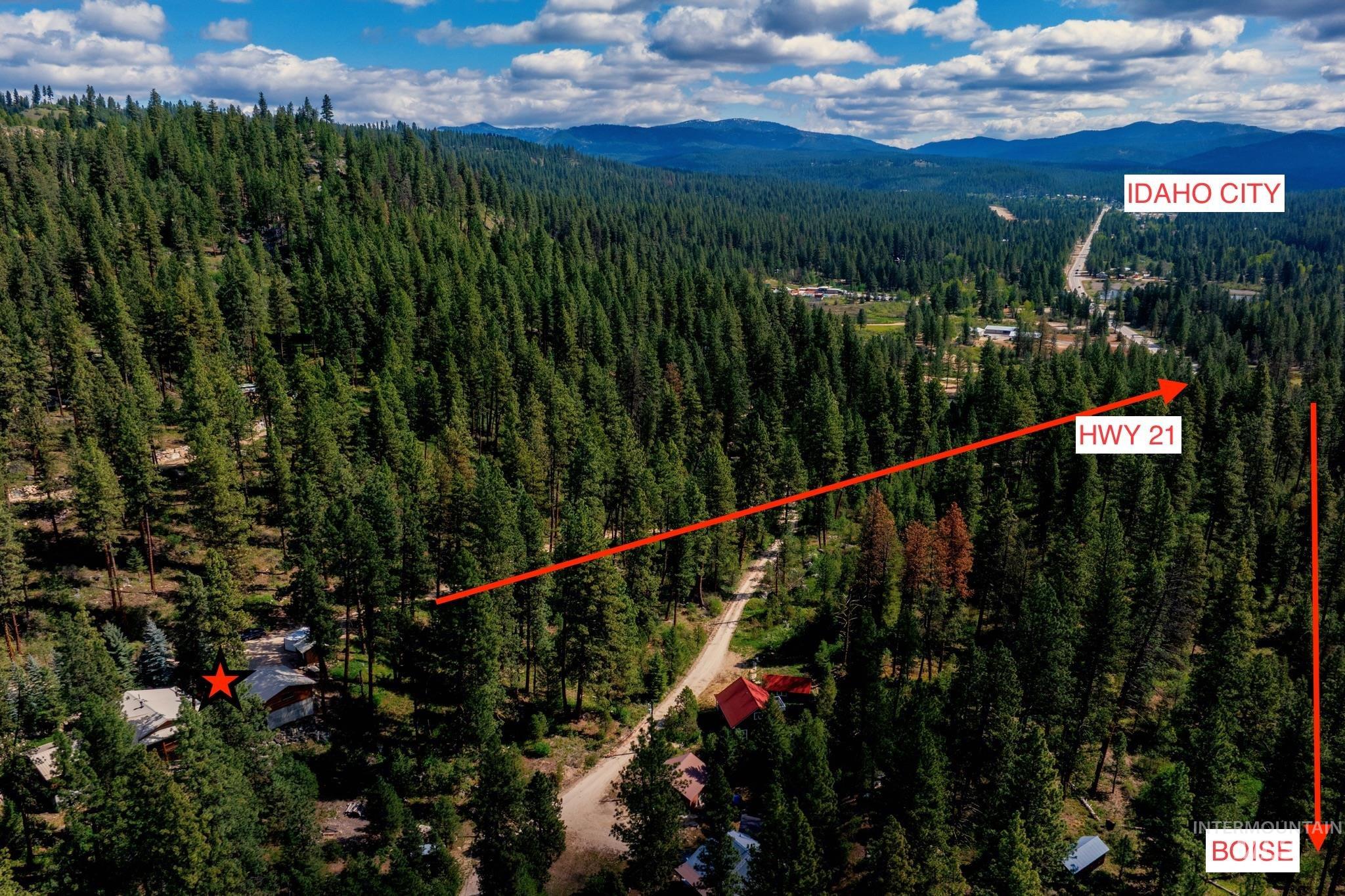85 Pine Top Road Boise, ID 83716 - Photo 31 of 33 Aerial perspective showcasing a property nestled within a densely forested mountain landscape