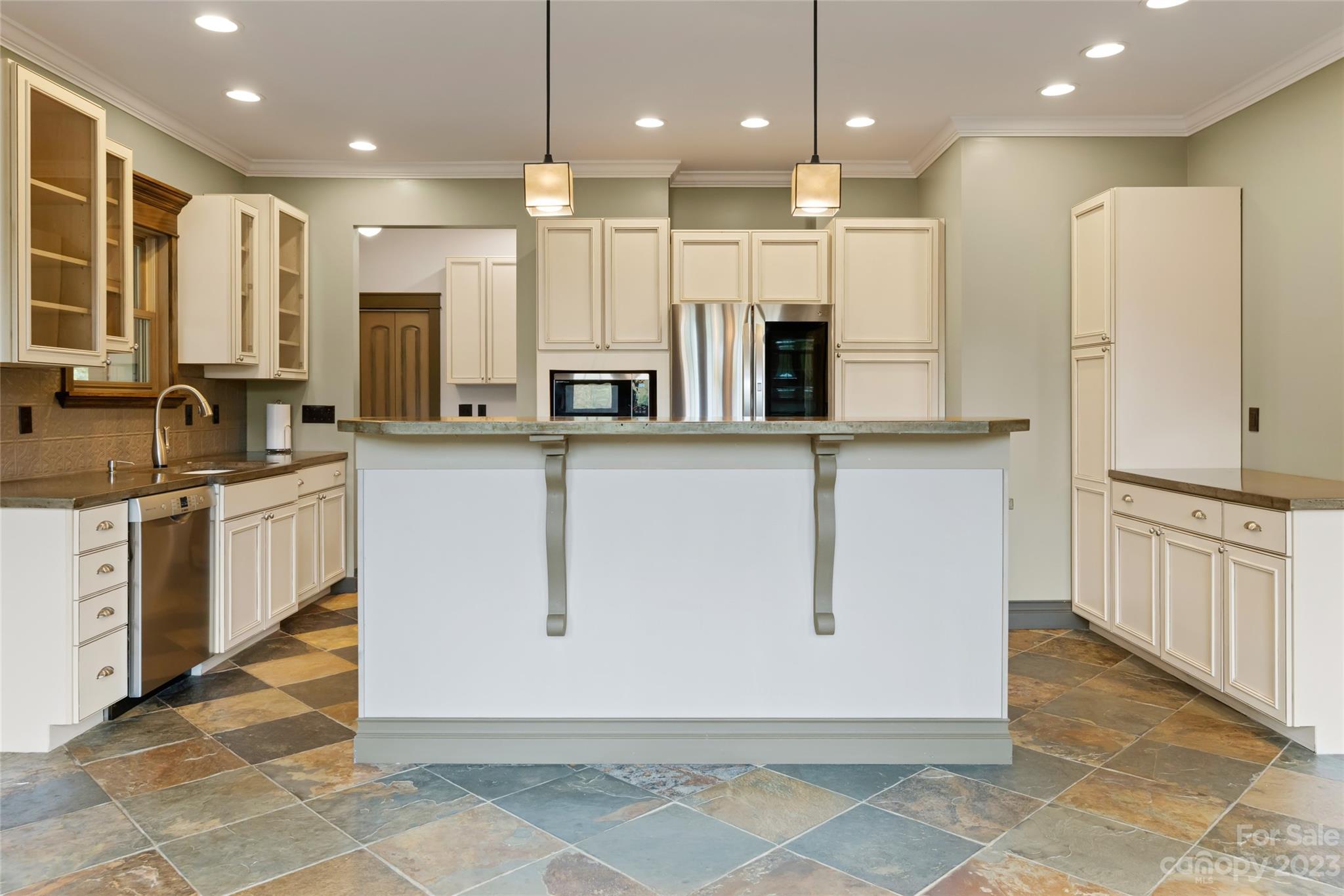 1025 Morgan Hill Road Black Mountain, NC 28711 - Photo 14 of 48 a large kitchen with stainless steel appliances kitchen island granite countertop a sink and cabinets