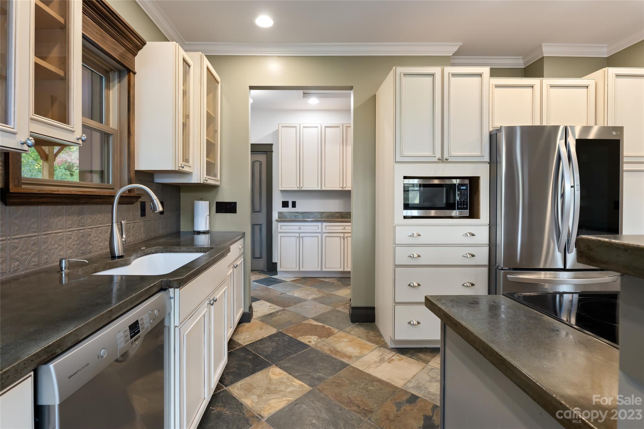 1025 Morgan Hill Road Black Mountain, NC 28711 - Photo 15 of 48 a kitchen with a sink stove and refrigerator