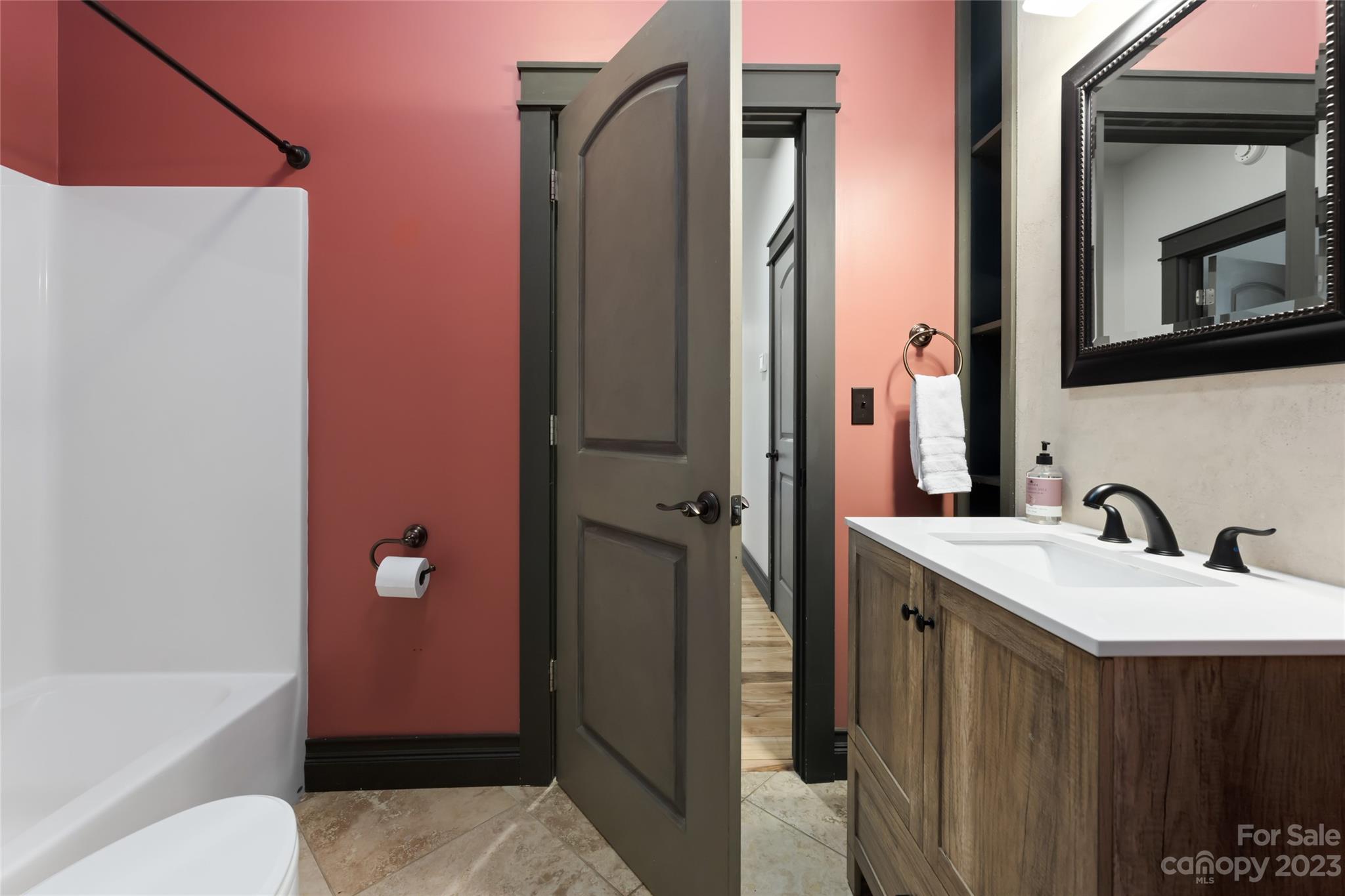 1025 Morgan Hill Road Black Mountain, NC 28711 - Photo 20 of 48 a bathroom with a sink a toilet and shower