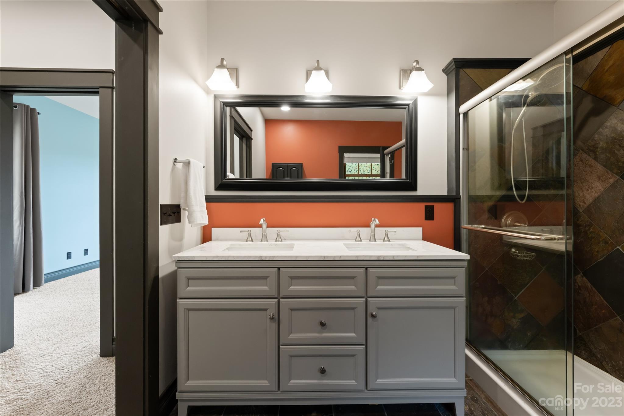 1025 Morgan Hill Road Black Mountain, NC 28711 - Photo 25 of 48 a bathroom with a sink and a mirror