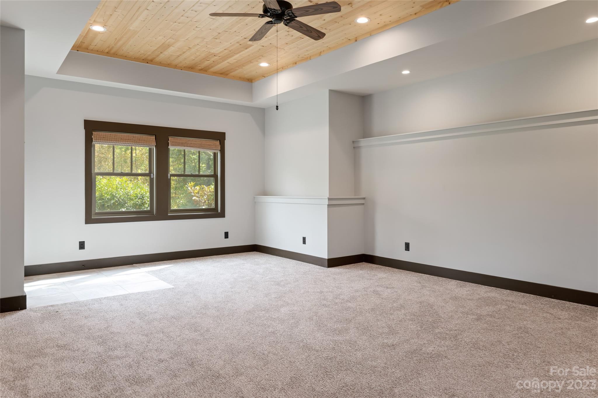1025 Morgan Hill Road Black Mountain, NC 28711 - Photo 29 of 48 an empty room with a ceiling fan and a window