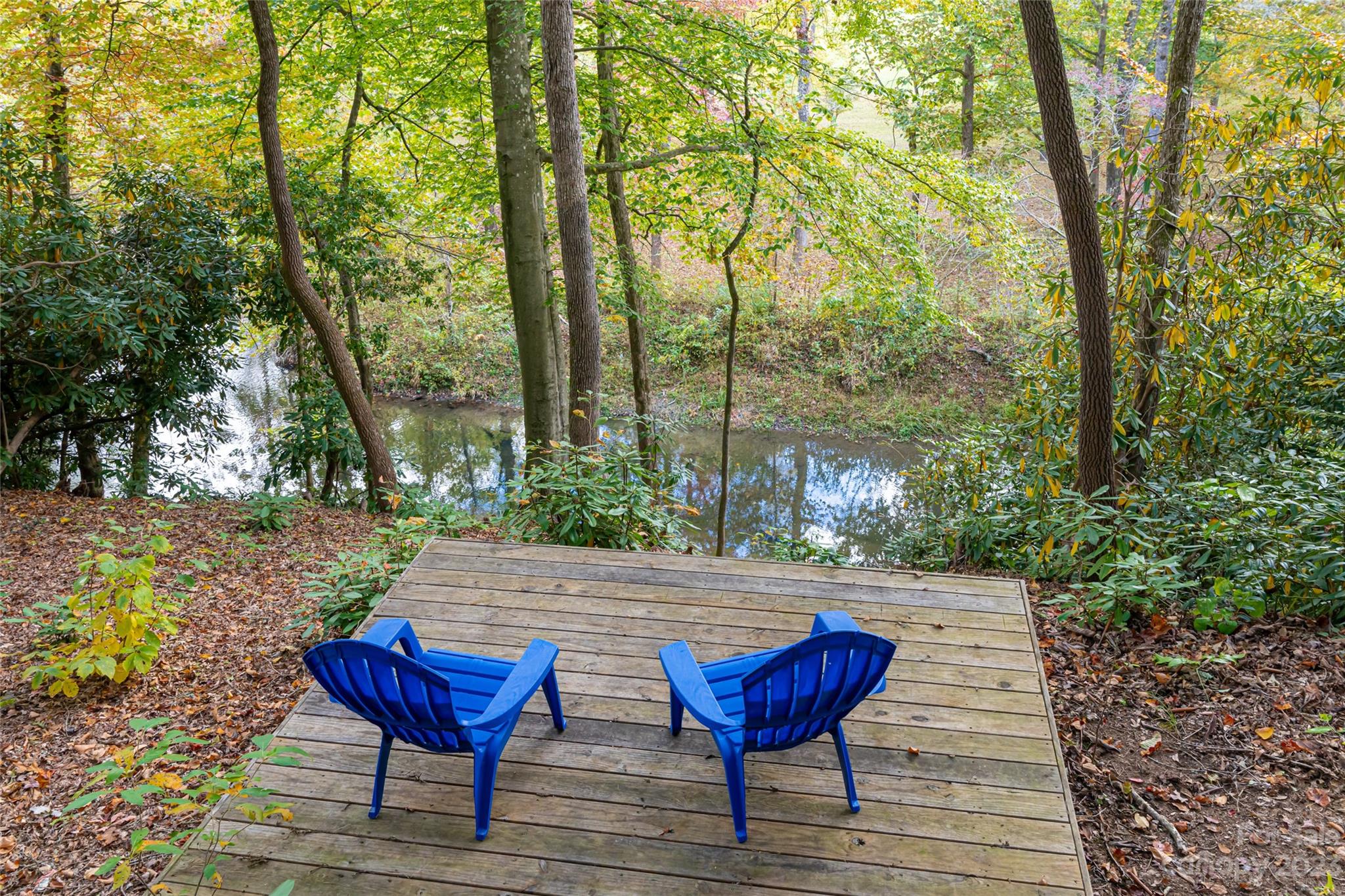 1025 Morgan Hill Road Black Mountain, NC 28711 - Photo 40 of 48 a view of a wooden chairs and bench in the garden