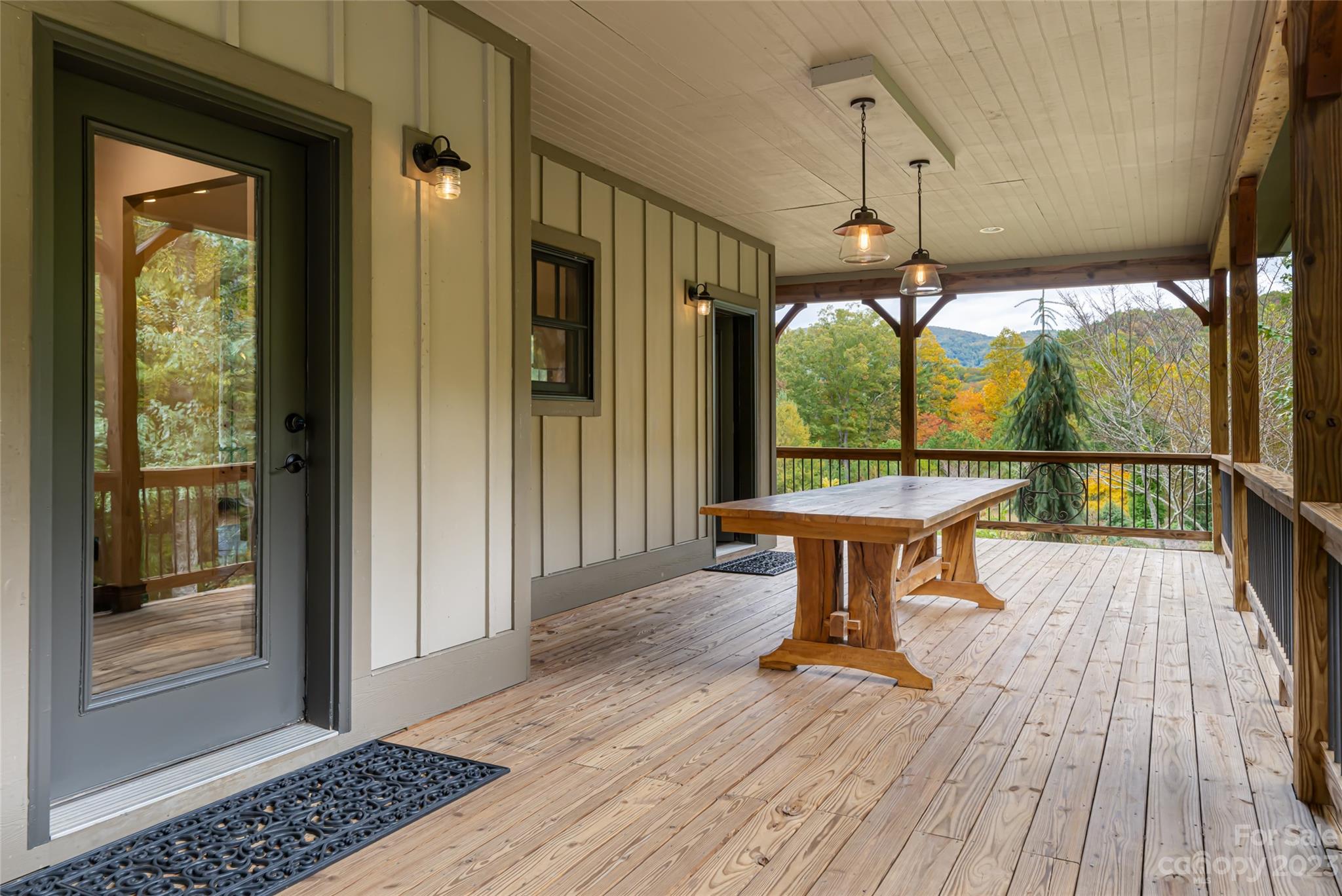1025 Morgan Hill Road Black Mountain, NC 28711 - Photo 45 of 48 a view of a porch with wooden floor and outdoor space