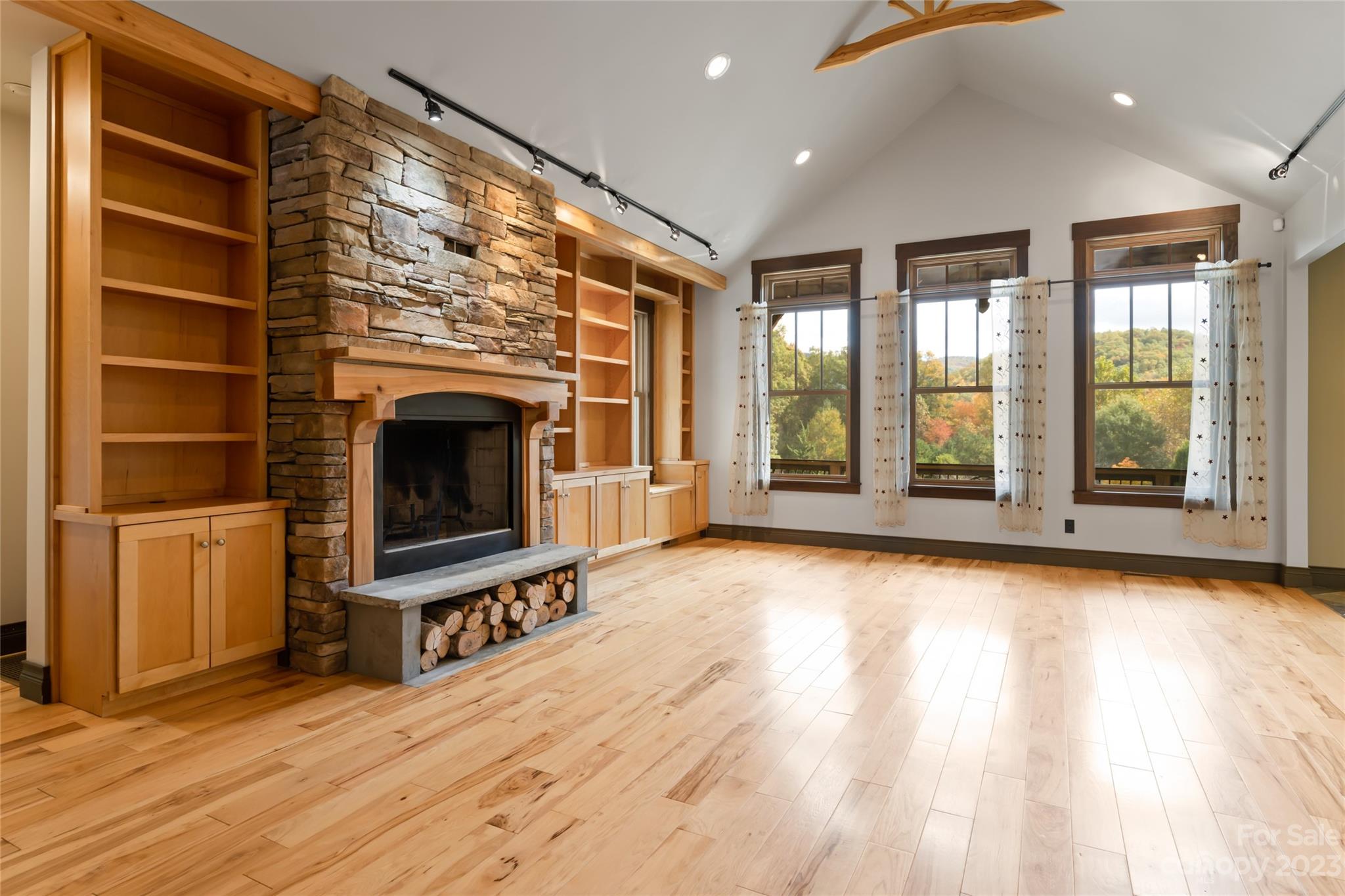 1025 Morgan Hill Road Black Mountain, NC 28711 - Photo 5 of 48 a view of an empty room with a fireplace and a window