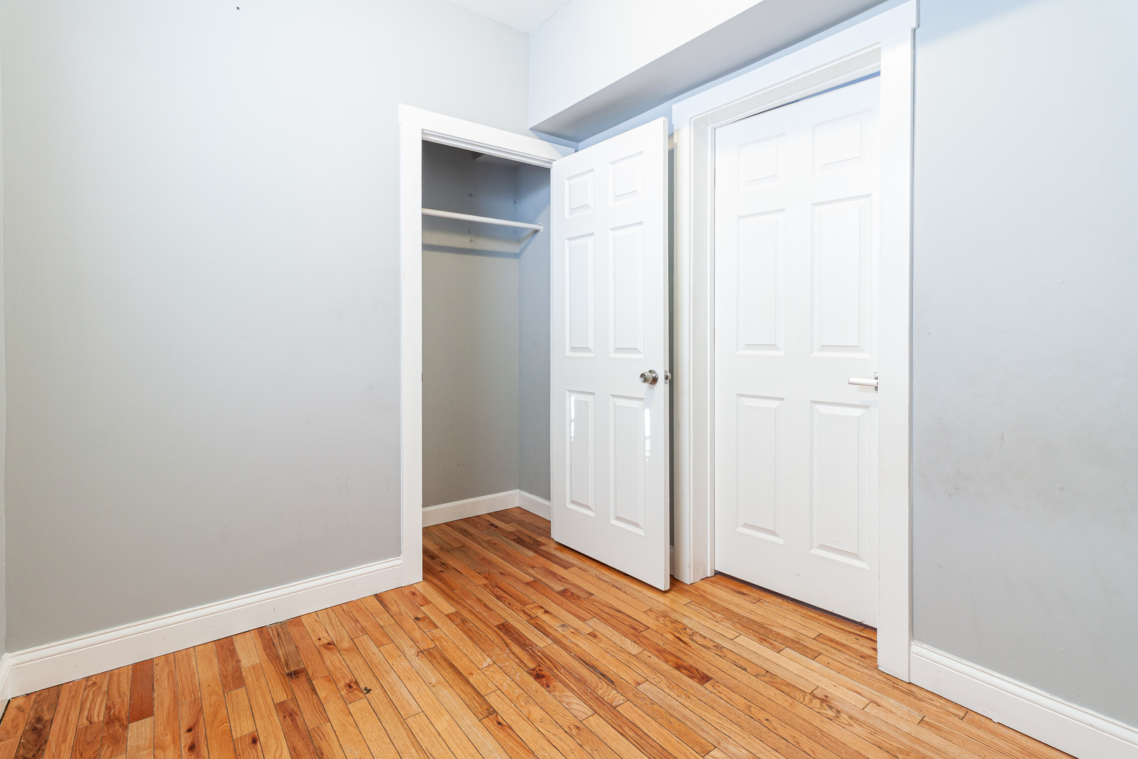 2968 North Ridgeway Avenue, Unit 2R Chicago, IL 60618 - Photo 17 of 23 a view of an empty room with wooden floor