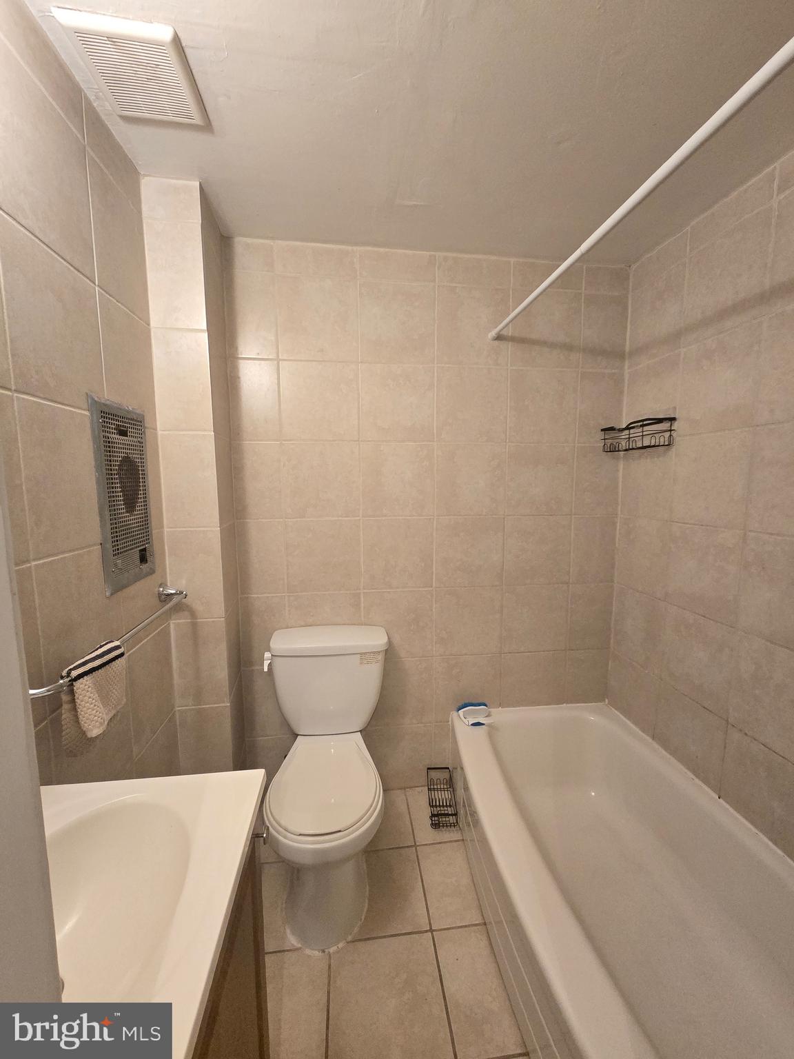 1413 Lombard Street, Unit 2R Philadelphia, PA 19146 - Photo 13 of 15 a bathroom with a toilet and a bathtub