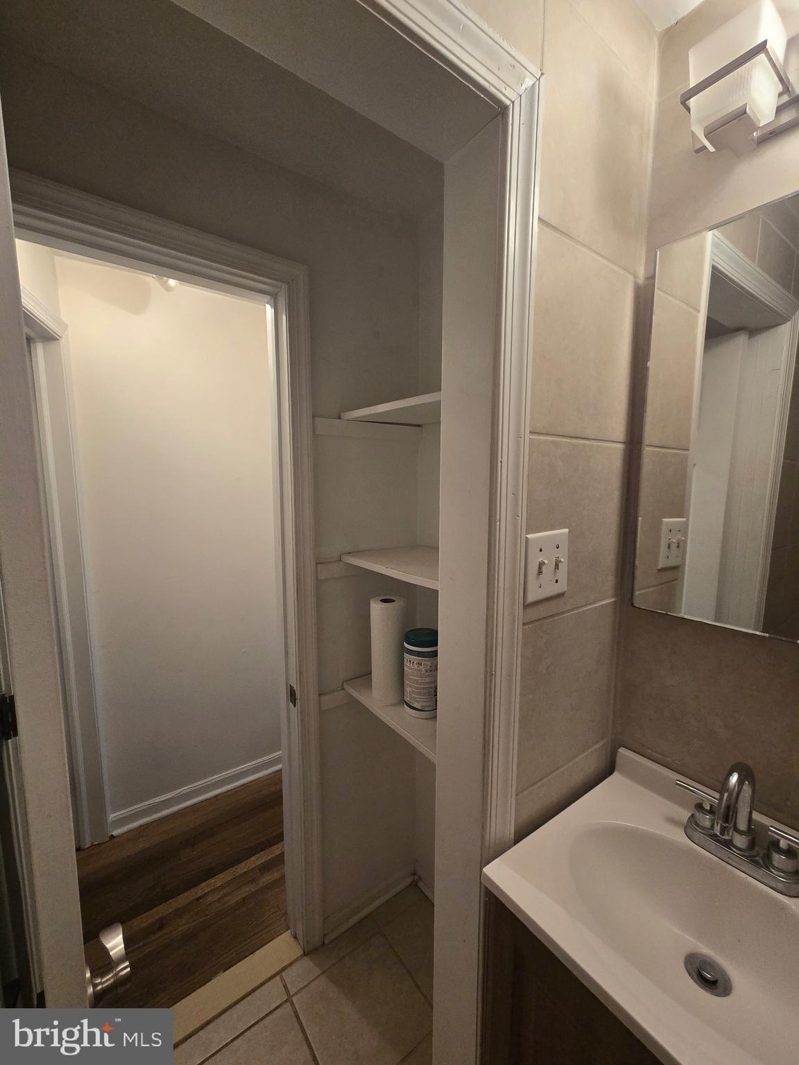 1413 Lombard Street, Unit 2R Philadelphia, PA 19146 - Photo 15 of 15 a bathroom with a sink a mirror and shower
