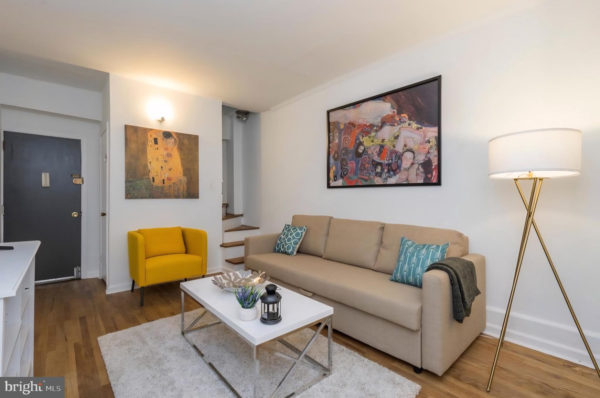 1413 Lombard Street, Unit 2R Philadelphia, PA 19146 - Photo 2 of 15 a living room with furniture and a couch