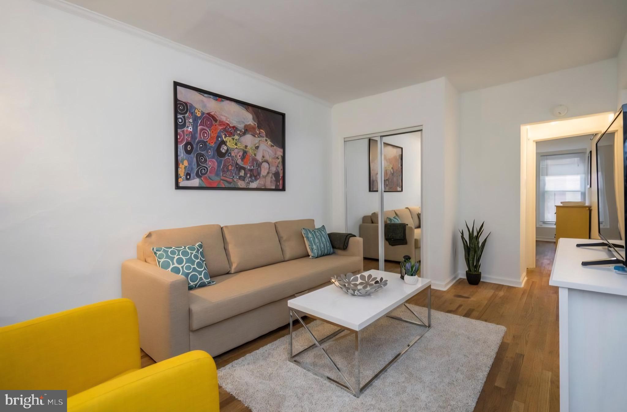 1413 Lombard Street, Unit 2R Philadelphia, PA 19146 - Photo 3 of 15 a living room with furniture and wooden floor