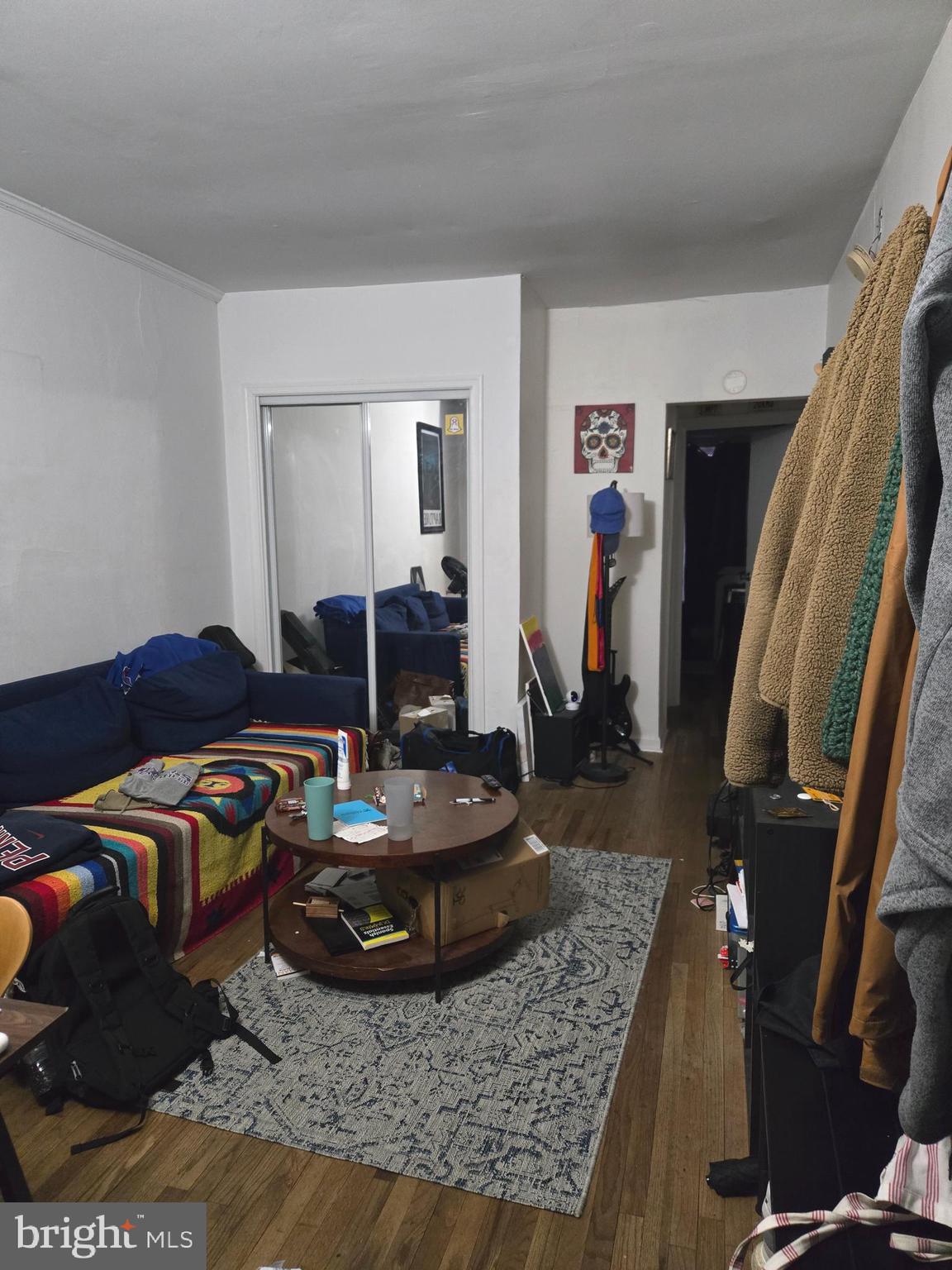 1413 Lombard Street, Unit 2R Philadelphia, PA 19146 - Photo 3 of 14 a living room with furniture and a wooden floor