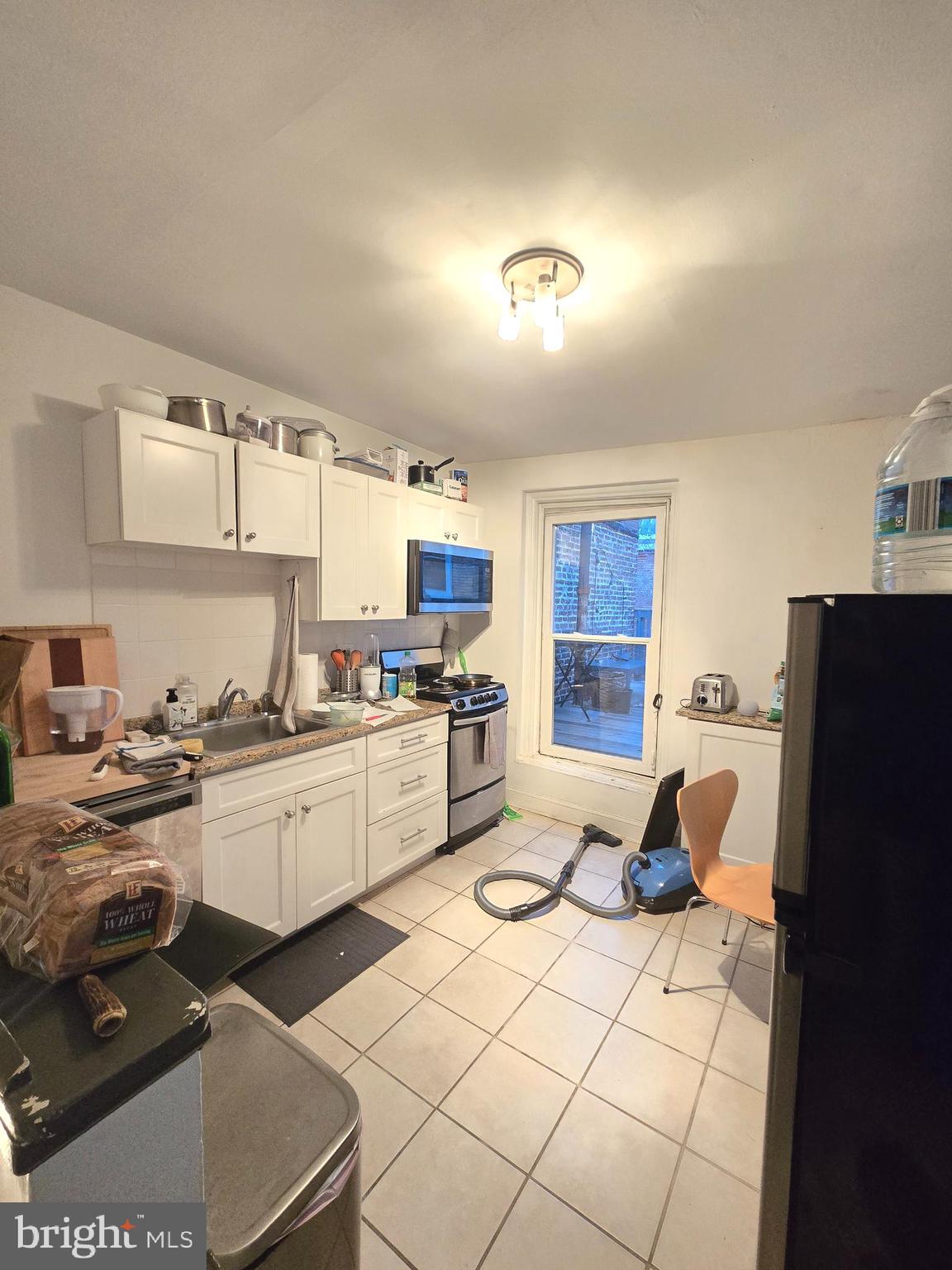 1413 Lombard Street, Unit 2R Philadelphia, PA 19146 - Photo 4 of 14 a kitchen with a sink appliances and cabinets