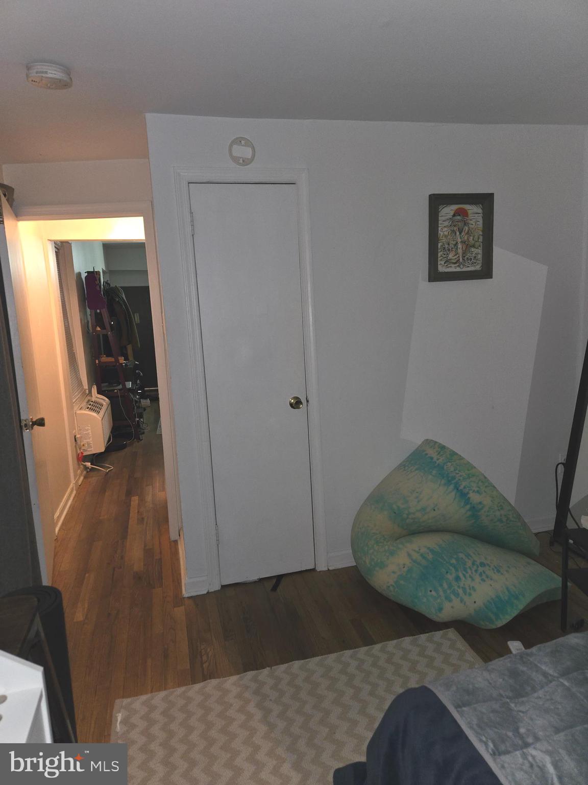 1413 Lombard Street, Unit 2R Philadelphia, PA 19146 - Photo 8 of 14 a living room with furniture and a rug