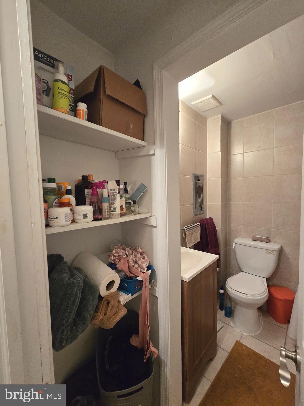 1413 Lombard Street, Unit 2R Philadelphia, PA 19146 - Photo 9 of 14 a bathroom with a toilet and a shower curtain