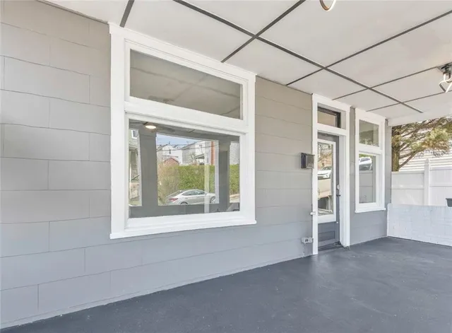 a view of a room that has a large window