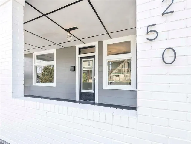 a view of a door and a window